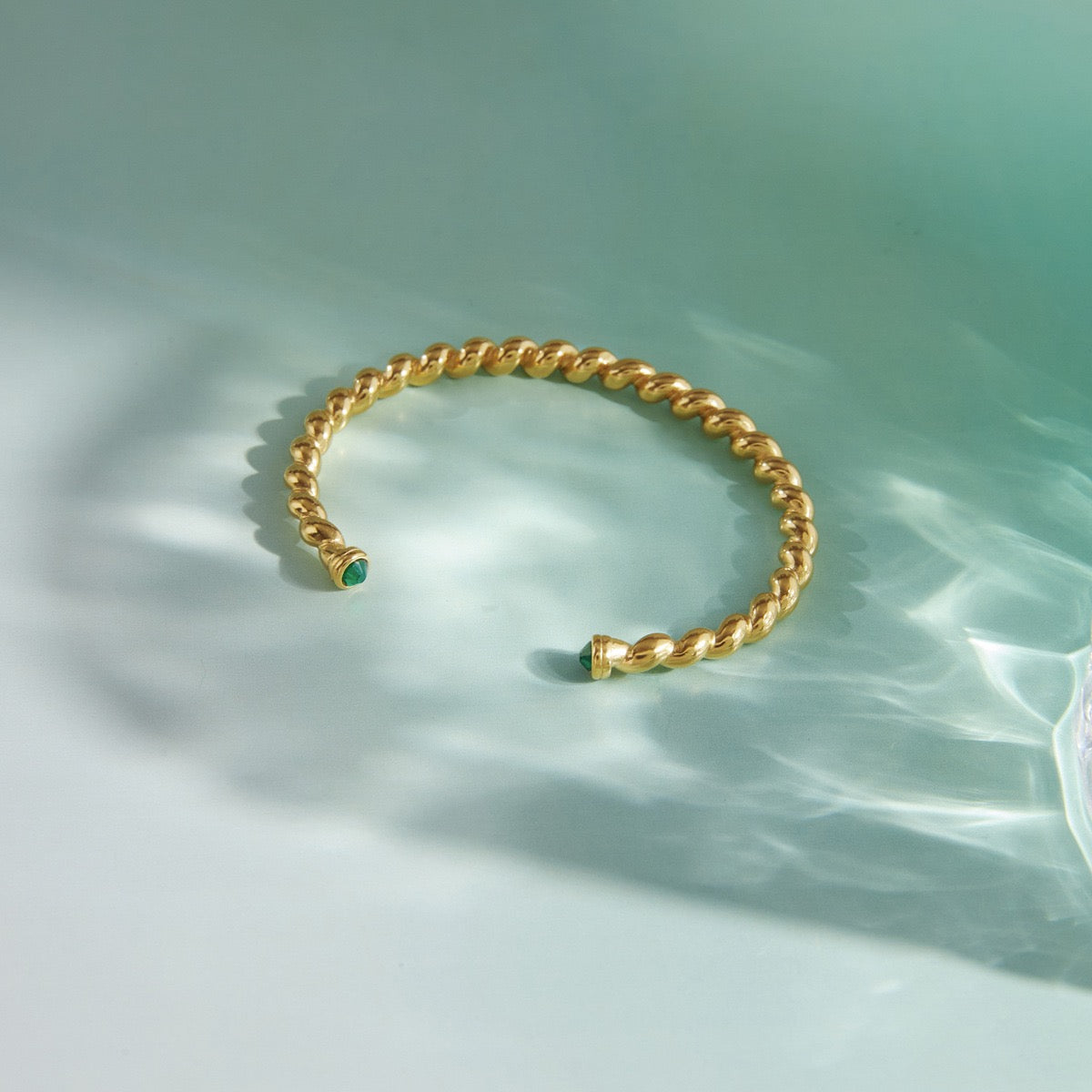 Twist Cuff Bracelet – Emerald Accent